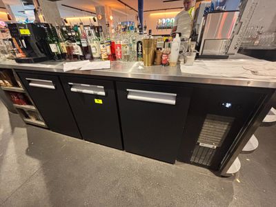 a bar with a lot of bottles on the counter