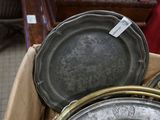 many pans and pans in a box on the floor
