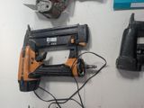 a staple gun and a stapler on the wall