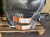 a pile of tires sitting on a pallet in a warehouse