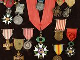a lot of medals and medals on display in a case