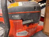 a chainsaw that is sitting on a table next to a box