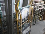 many ladders that are lined up in a room