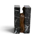 marble bookends in the shape of a man ' s torso