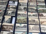 several old postcards of different types and sizes on a table