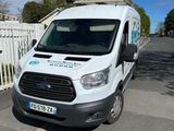 a white van that is parked on the side of the road