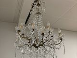 a chandelier hanging from the ceiling in a room