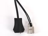 a close up of a metal padlock on a black leather strap