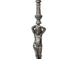 a silver statue of a boy holding a lamp post on a white background