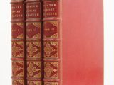 a set of three red books sitting on top of each other