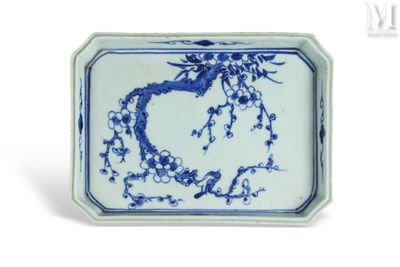 a blue and white plate with a bird on it