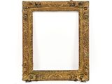 a gold frame with a decorative pattern on it
