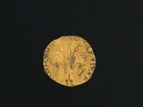 une image représentant une pièce d'or ornée d'un motif floral