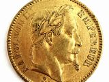 l'image d'une pièce d'or sur laquelle figure le visage d'un homme