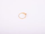 a gold ring on a white background