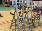 many ladders that are sitting in a room