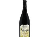 a bottle of wine sitting on top of a white table