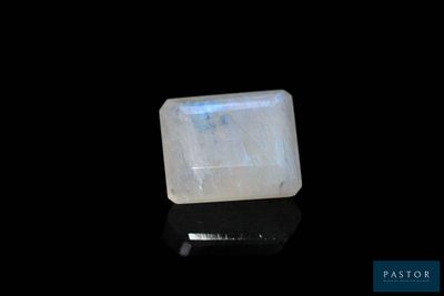 a white quartz stone on a black surface