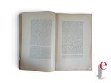 an open book on a white surface with a red and white logo