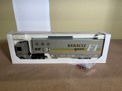 the train is in the box on the table next to the box