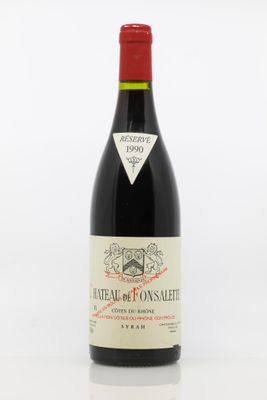 la bouteille de vin est posée sur une surface blanche