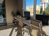 an image of a conference room with a view of the city