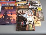a lot of comic books on the table