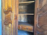 a large wooden cabinet with a drawer inside of it