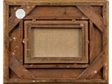 an old wooden frame with a picture hanging on the wall
