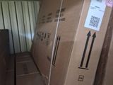 many boxes stacked on top of each other in a room