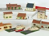 a lot of small toy houses on display on a shelf