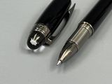 two pens sitting next to each other on a table