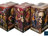 three boxes of one piece figurines on a white background