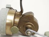 a close up of a fishing reel with a hook on it
