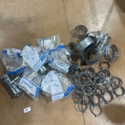 a lot of different types of metal parts on the floor
