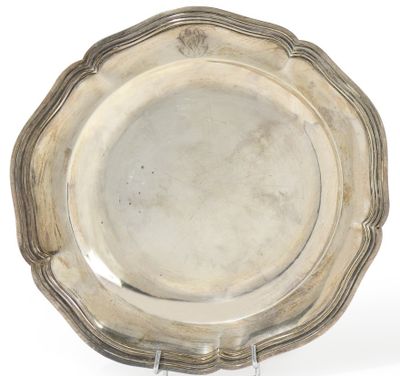an antique silver plate on a stand on a white background