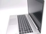 a laptop computer that is sitting on a white surface