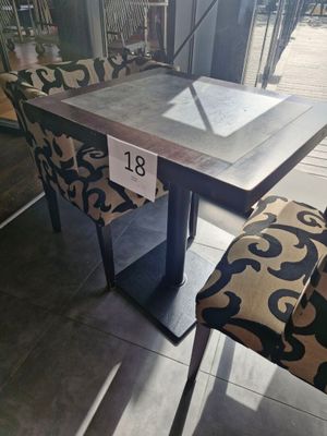 a table with a chair and a table with a number on it