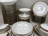 a lot of plates and bowls that are on the table