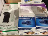 several boxes of dental care items are stacked on a table