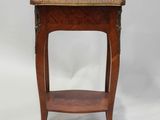 a small wooden table with a shelf on top of it
