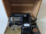 a wooden box with a typewriter inside of it