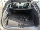 the trunk of a car with a bunch of wires in it