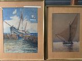 tableau représentant un bateau et un voilier, encadré et posé sur une table