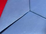 a close up view of a blue leather wallet
