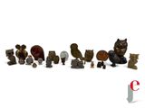 many different types of figurines displayed on a white surface