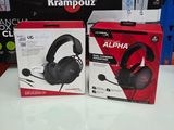 two boxes of gaming headsets are on a table in a store