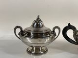 pair of silverplated teapots with handles and handles