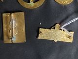 several pieces of metal are laying on a black surface