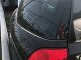 a black car that is parked in a parking lot